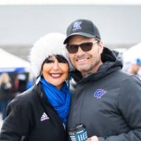 President Mantella smiles with her husband at the tailgate
